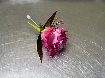 A Boutonniere - purple rose
