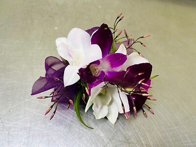 A Wrist Corsage - purple and white orchids